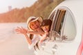 Happy family young woman and her daughter sitting in white car with hand up Royalty Free Stock Photo