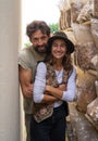 happy farmer couple against mushroom farm