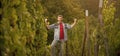 happy farmer vinedresser. male vineyard owner. professional vintner on grape farm Royalty Free Stock Photo