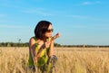 Happy farmer woman worker in wheat field