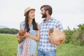 Happy farmers holding chicken and eggs Royalty Free Stock Photo