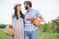 Happy farmers holding chicken and eggs Royalty Free Stock Photo