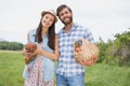 Happy farmers holding chicken and eggs Royalty Free Stock Photo