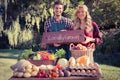 Happy farmers standing at their stall