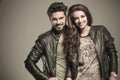 Happy fashion couple in leather jackets smiling Royalty Free Stock Photo