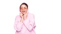 Happy fashion girl smiling in stylish glasses and casual pink hoodie isolated on white, copy space