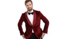 Happy fashion man wearing red velvet tuxedo and smiling Royalty Free Stock Photo