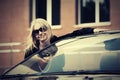 Happy fashion woman in sunglasses next to her car Royalty Free Stock Photo