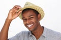 Happy fashionable man smiling with hat on white background
