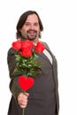 Happy fat Caucasian businessman smiling giving red roses and hea