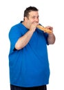 Happy fat man eating a large bread Royalty Free Stock Photo