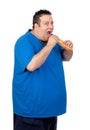 Happy fat man eating a large bread Royalty Free Stock Photo