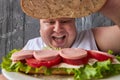 Happy fat man is opening sandwich top Royalty Free Stock Photo