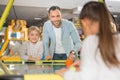 happy father with adorable little kids playing air hockey Royalty Free Stock Photo