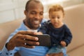 Happy father amusing his baby Royalty Free Stock Photo