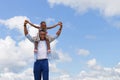 Happy father carrying daughter on shoulders, Cheerful african american girl on the shoulders of his father with clipping path Royalty Free Stock Photo