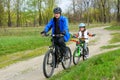 Happy father and child on bikes, family cycling Royalty Free Stock Photo