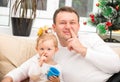 Happy father and child girl hugging and picking his nose Royalty Free Stock Photo