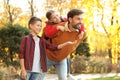 Happy father and children spending time. Autumn walk Royalty Free Stock Photo