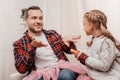 happy father with cute little daughter polishing