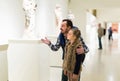 Father and daughter looking at ancient bas-reliefs in museum Royalty Free Stock Photo