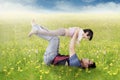 Happy father and daughter playing on meadow Royalty Free Stock Photo