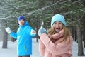 Happy father and daughter playing snowballs in forest Royalty Free Stock Photo