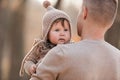 Happy father and daughter playing while walking in a beautiful autumn park. Ideal weekend father with his little daughter. father