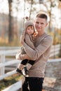 Happy father and daughter playing while walking in a beautiful autumn park. Ideal weekend father with his little daughter. father