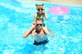 Happy father with daughter resting in swimming pool Royalty Free Stock Photo