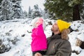 Happy Father And Daughter Smiling In A Snowy Forest