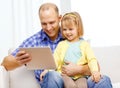 Happy father and daughter with tablet pc computer Royalty Free Stock Photo