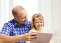 Happy father and daughter with tablet pc computer Royalty Free Stock Photo