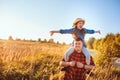 Happy father and daughter walking on summer meadow, having fun and playing. Royalty Free Stock Photo