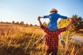 Happy father and daughter walking on summer meadow, having fun and playing. Royalty Free Stock Photo