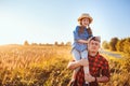 Happy father and daughter walking on summer meadow, having fun and playing. Royalty Free Stock Photo