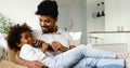 Happy father and daughter and watching tv at home Royalty Free Stock Photo