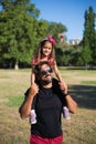 Happy father with disability playing with daughter in park Royalty Free Stock Photo