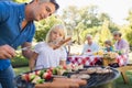 Happy father doing barbecue with her daughter Royalty Free Stock Photo