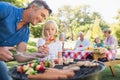 Happy father doing barbecue with her daughter Royalty Free Stock Photo