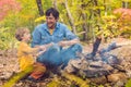 Happy father doing barbecue with his son on an autumn day Royalty Free Stock Photo