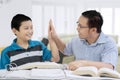 Happy father doing high five with his son Royalty Free Stock Photo