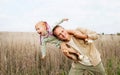 Happy Father And Emotional Child Having Fun Playing Outdoors. Smiling Young Dad And Daughter Spending Time Together In Nature Royalty Free Stock Photo