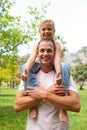 Happy father giving his daughter piggy-back ride Royalty Free Stock Photo