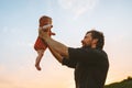 Happy father hands holding infant baby outdoor joyful family Royalty Free Stock Photo