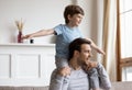 Happy father have fun at home with little son Royalty Free Stock Photo