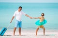 Happy father and his adorable little daughter at tropical beach having fun Royalty Free Stock Photo