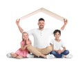 Happy father and his children sitting under cardboard roof on background. Insurance concept Royalty Free Stock Photo