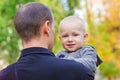 Happy father and his son outdoors. Child hugging daddy. Royalty Free Stock Photo