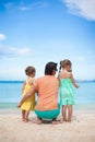 Happy father with his two daughters sitting on Royalty Free Stock Photo